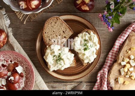 Three slices of sourdough bread with spread made from leftover hard-boiled brown Easter eggs Stock Photo