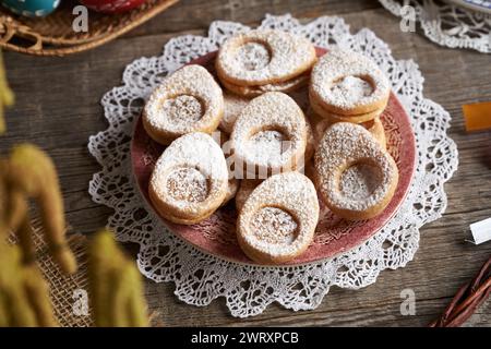 Linzer cookies in the shape of Easter eggs on a plate Stock Photo