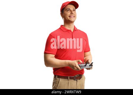 Drone operator holding a remote controller and looking up isolated on white background Stock Photo