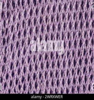 Seamless texture photo of purple lavander colored wool net sweater material. Stock Photo