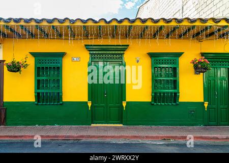 Facade of a colorful house in Jardin, Colombia Stock Photo