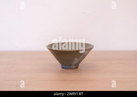 Handmade japanese style ceramic bowl on wood. High quality photo Stock Photo