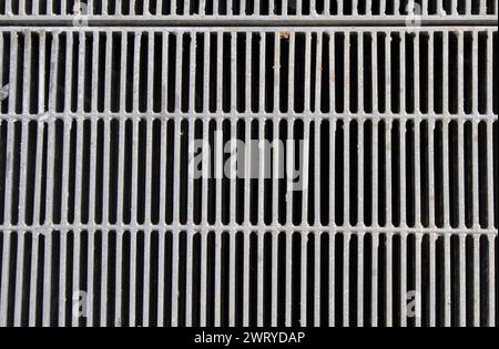 Close up textured background of a metal grating grid Stock Photo