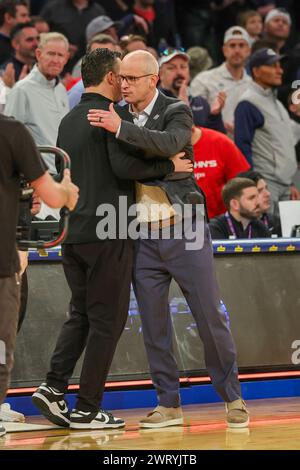 UConn head coach Dan Hurley, right, hugs Villanova head coach Kyle ...