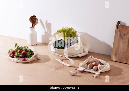 salad ingredients in net bags and eco bags Stock Photo