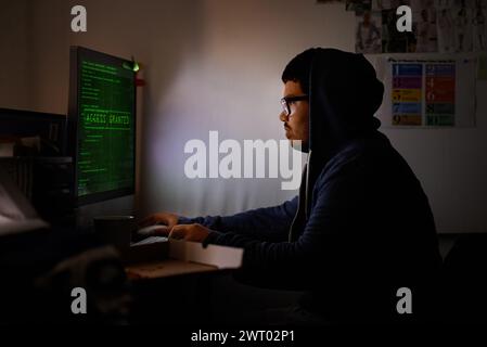 Programming, computer and man with hacker, night or cyber security with online database, malware or password phising. Person, IT programmer or Stock Photo