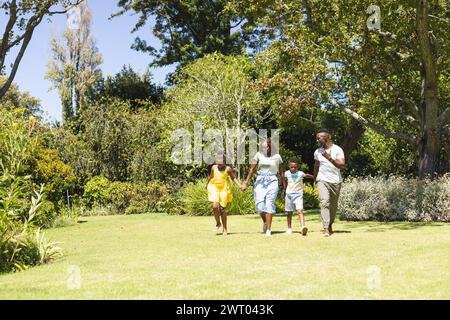 African American family enjoys a sunny day outdoors with copy space Stock Photo
