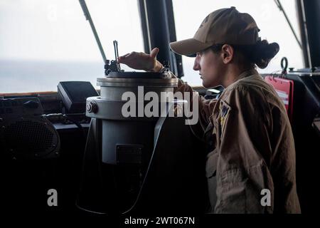 At Sea. 26th Feb, 2024. An Ensign stands watch aboard the Arleigh Burke-class guided-missile destroyer USS Mason (DDG 87) during a strait transit, February. 26. As a part of the USS Dwight D. Eisenhower Carrier Strike Group, Mason is deployed to the U.S. 5th Fleet area of operations to support Marchitime security and stability in the Middle East. Credit: U.S. Navy/ZUMA Press Wire/ZUMAPRESS.com/Alamy Live News Stock Photo