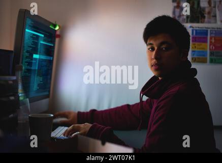 Night, portrait and man with computer for coding systems or designing software, cybersecurity and developer for company. Male person, programming or Stock Photo