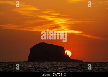 File photo dated 21/04/23 of sunrise behind the Bass Rock in the Firth of Forth near North Berwick, East Lothian. The Scottish seaside town of North Berwick in East Lothian has been named the best place to live in an annual guide. It topped a list of 72 locations chosen by The Sunday Times to represent the best of the UK in the annual Sunday Times Best Places to Live guide. The comprehensive guide is released online on Friday, with an abridged version to be published as a magazine supplement on Sunday. Issue date: Friday March 15, 2024. Stock Photo