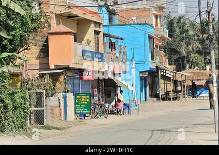 Street scene with shops and some people in an urban environment, Chitwan National Park, Bhairahawa, Nepal Stock Photo