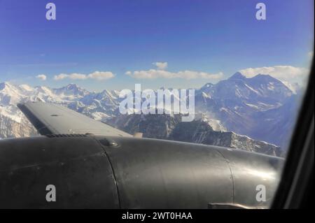 View through an aeroplane window of snow-covered mountain ranges, impressions from the great panoramic flight along the Himalayan giants, the roof of Stock Photo