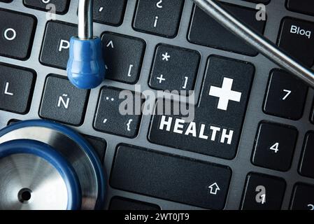 Online healthcare service concept with computer keyboard with enter key with text health and cross and stethoscope. Top view Stock Photo