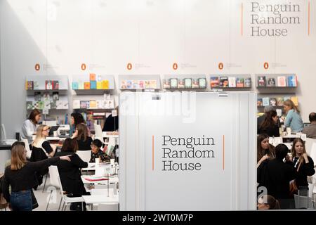 Meetings and book deals on the Penguin Random House book trade stand during the third and final day of the London Book Fair at the Olympia Exhibition Hall, on 14th March 2024, in London, England. The three-day international London Book Fair (LBF) is an annual publishing industry expo and Europe's largest spring book fair that typically attracts 25,000 visitors; exhibitors from across the publishing sector; authors hoping for their book ideas to be commissioned and where international publication rights deals are made for foreign editions. Stock Photo