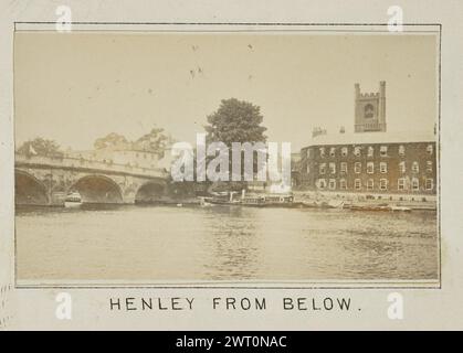 Henley from Below. Henry W. Taunt, photographer (British, 1842 - 1922) 1897 One of four tipped-in photographs illustrating a printed map of Medmenham and the surrounding area along the River Thames. The photograph shows a view of the river with Henley Bridge on the left side of the image. The tower of the Church of St. Mary the Virgin is visible over the buildings of the town of Henley-on-Thames, which sits on the far side of the river. (Recto, mount) lower center, below image, printed in black ink: 'HENLEY from below.[italicized]' Stock Photo