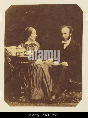 Portrait of man and woman. Sir John Joscelyn Coghill, photographer (Irish, 1826 - 1905) about 1850s A portrait of a man and woman, seated opposite one another beside a small table. The man has a cup and saucer in his lap. (Recto, mount) upper right, pencil: '47'; Stock Photo