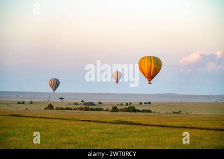 Hot air balloons floating over the Maasai Mara in Kenya Stock Photo