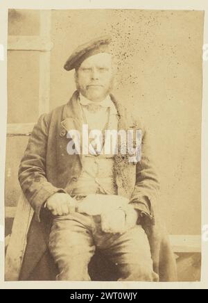 Portrait of man in hat. Sir John Joscelyn Coghill, photographer (Irish, 1826 - 1905) about 1850s Portrait of a man wearing a beret. He is holding two small items in his lap. (Recto, mount) upper right, pencil: '71'; Stock Photo