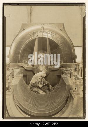 The Heart of the Turbine. Lewis W. Hine, photographer (American, 1874 - 1940) negative about 1921, print about 1930 Secondary Inscription: Inscribed on verso print in pencil: '1P1 (1B1)/Repairing turbinein power house/The heart of the turbine/MEN AND MACHINE SERIES c. 1921/GEH/Hine 35'. Stock Photo