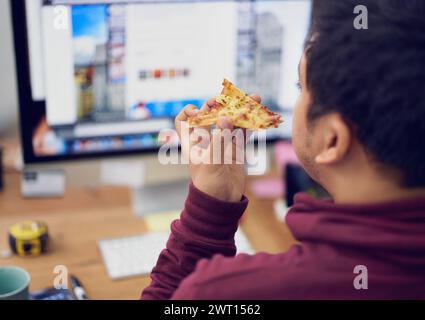 Businessman, eating and lunch with computer screen in office with rear view and pizza break for working on deadline. Programmer, employee and back Stock Photo