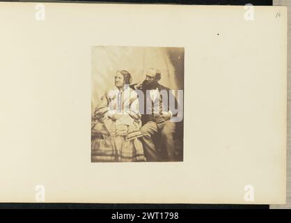 Portrait of man and woman. Sir John Joscelyn Coghill, photographer (Irish, 1826 - 1905) about 1850s A portrait of a seated man and woman. The woman has both of her hands in her lap and is looking to the left. The man is resting his chin in his hand, his elbow placed behind the woman. (Recto, mount) upper right, pencil: '16'; Stock Photo