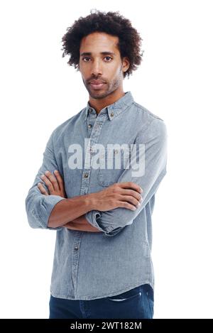 Fashion, crossed arms and portrait of man in studio with casual, trendy and denim shirt outfit. Serious, confident and young male person from Colombia Stock Photo