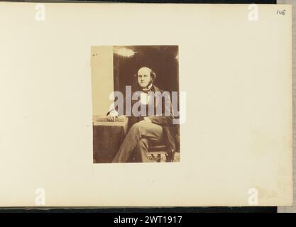 Portrait of man. Sir John Joscelyn Coghill, photographer (Irish, 1826 - 1905) about 1850s Portrait of a seated man with a beard. One arm is resting on a book on a small table. His legs are crossed. (Recto, mount) upper right, pencil: '146'; Stock Photo