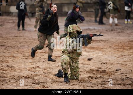 Ukrainian women training to shoot with rifles on a military polygon. Kyiv - 27 January,2024 Stock Photo