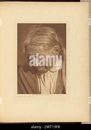 Eagle Chief - Arapaho. Edward S. Curtis, photographer (American, 1868 - 1952) negative 1910, print 1911 A half-profile portrait of a man looking down. Stock Photo