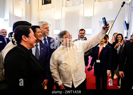 Prague, Czech Republic. 15th Mar, 2024. A participant of the Czech-Philippine Business Forum takes a selfie with Czech President Petr Pavel (fourth from left) and Philippine President Ferdinand Marcos (third from left) in Prague, Czech Republic, March 15, 2024. Credit: Roman Vondrous/CTK Photo/Alamy Live News Stock Photo