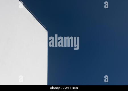 modern white wall with blue sky background Stock Photo