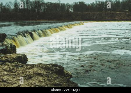 At Ventas Rumba, immerse yourself in the beauty of Latvia's largest waterfall, a mesmerizing sight to behold. Stock Photo