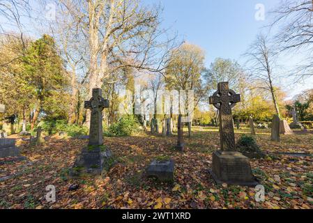 The churchyard at St Peter's Church in Harborne, Birmingham in autumn Stock Photo