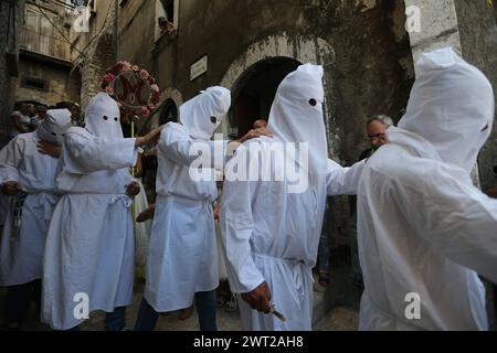 Hooded men, called 'battenti', during the seven-year rituals in honor of Our Lady of Assumption. A religious procession that is held seven years, star Stock Photo