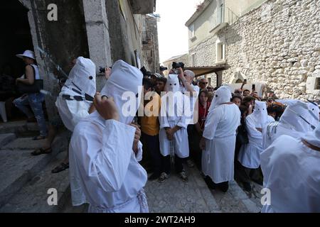 Hooded men, called 'battenti', during the seven-year rituals in honor of Our Lady of Assumption. A religious procession that is held seven years, star Stock Photo