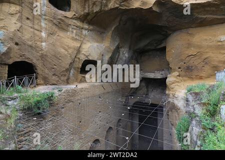 The tuff wall in front of the entrance to the cave of the Sibilla Cumana, the priestess of Apollo, one of the most important Sibyls, prophetic figures Stock Photo