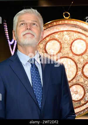Dresden, Germany. 15th Mar, 2024. Petr Pavel, President of the Czech Republic, stands in front of a basin with mother-of-pearl inlays from the Sultanate of Gujarat (now India) from before 1598 before the opening of the exhibition 'Fragments of Memory - the Treasure of St. Vitus Cathedral in Prague' in the Kunsthalle Lipsius-Bau. The focus of the visit is on the neighborly relations between Saxony and the Czech Republic and economic and cultural cooperation. Credit: Robert Michael/dpa/Alamy Live News Stock Photo