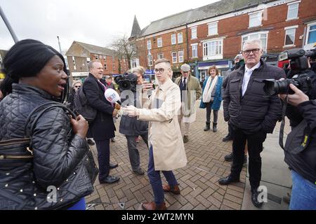 A woman heckles former Conservative deputy chairman Lee Anderson MP as he campaigns in his constituency of Ashfield, Nottinghamshire. Picture date: Friday March 15, 2024. Stock Photo