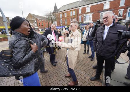 A woman heckles former Conservative deputy chairman Lee Anderson MP as he campaigns in his constituency of Ashfield, Nottinghamshire. Picture date: Friday March 15, 2024. Stock Photo