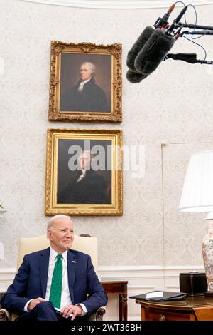 Washington, United States. 15th Mar, 2024. U.S. President Joe Biden reacts to a reporter's questions while meeting with Ireland's Taoiseach Leo Varadkar (not pictured) in the Oval Office at the White House in Washington, DC on Friday, March 15, 2024. Photo by Nathan Howard/UPI Credit: UPI/Alamy Live News Stock Photo