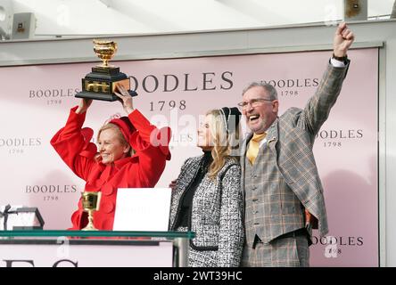 Audrey Turley (left), owner of Galopin Des Champs, with her husband Greg Turley and daughter Sarah, after winning the Boodles Cheltenham Gold Cup Steeple Chase which was ridden to victory by Paul Townend on day four of the 2024 Cheltenham Festival at Cheltenham Racecourse. Picture date: Friday March 15, 2024. Stock Photo