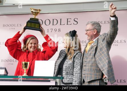 Audrey Turley (left), owner of Galopin Des Champs, with her husband Greg Turley and daughter Sarah, after winning the Boodles Cheltenham Gold Cup Steeple Chase which was ridden to victory by Paul Townend on day four of the 2024 Cheltenham Festival at Cheltenham Racecourse. Picture date: Friday March 15, 2024. Stock Photo