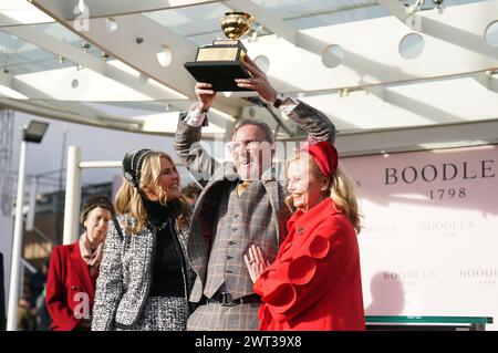 Audrey Turley (right), owner of Galopin Des Champs, with her husband Greg Turley and daughter Sarah, after winning the Boodles Cheltenham Gold Cup Steeple Chase which was ridden to victory by Paul Townend on day four of the 2024 Cheltenham Festival at Cheltenham Racecourse. Picture date: Friday March 15, 2024. Stock Photo