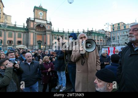 Former general Antonio Pappalardo, leader of the orange vests, speaks with a megaphone during the No Green Pass and No Vax demonstration in Naples. Stock Photo