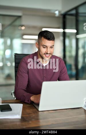 Smiling busy business man company employee using laptop working in office. Stock Photo