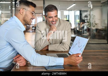 Financial advisor consulting investor explaining financial trade stock market. Stock Photo