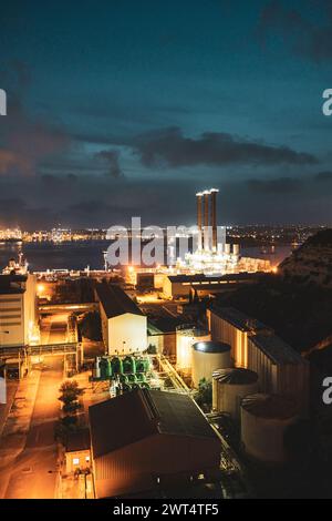 View of industrial plant at night. Malta Stock Photo