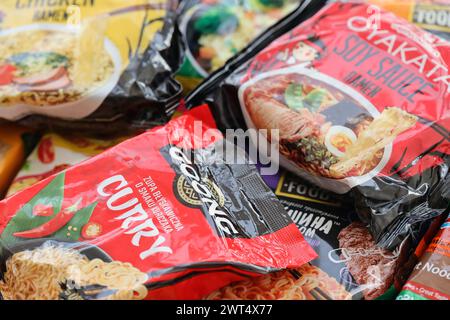 KYIV, UKRAINE - OCTOBER 31, 2023 Many packs of instant noodles for fast cooking by various brands and manufacturers close up Stock Photo