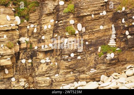 Human, natural art usuing local stones and placing them in artistic fashion on a cliff wall on the Brough of Birsay, Orkney, Scotland UK Stock Photo