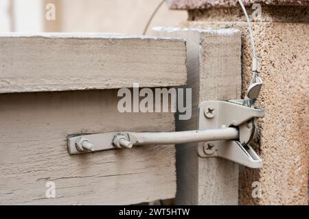 Latch on gate. A design for locking of gate from within Stock Photo